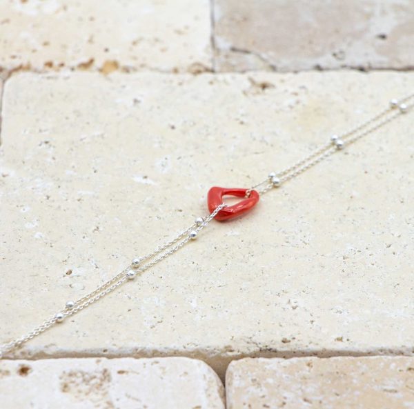 Le noeud / le lien argent perlée est un bracelet en corail rouge fabriqué par L'atelier du corail à Marseille.